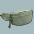 Load image into Gallery viewer, Light green cordrouy fanny pack with green braided tassle and zipper pulls.
